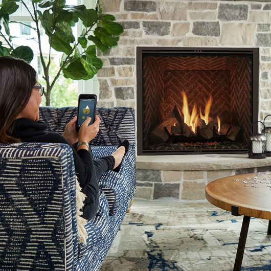 MAJESTIC wood burning fireplace with herringbone interior and custom stone surround