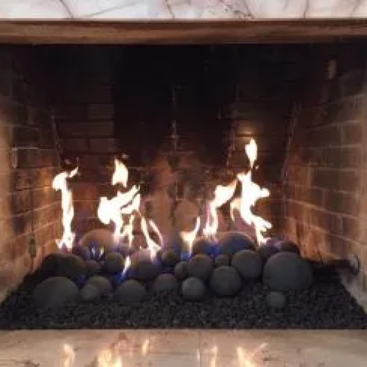 MODERN gas fireplace with round stone set
